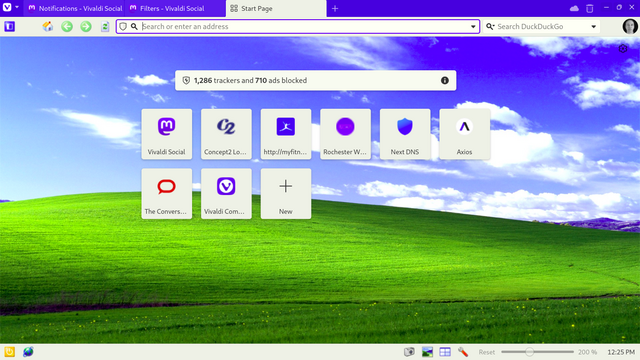 Screen shot of a Linux desktop with Vivaldi browser. The background uses the Windows Bliss wallpaper, which shows a green rolling hill under a blue sky with scattered clouds. The icons are in the style of the old Windows XP icons. 

On the start page, shortcuts can be seen to Mastodon, Concept2, MyFitnessPal, Rochester Wastewater monitoring, NextDNS, Axios, The Conversation, and Vivaldi community.