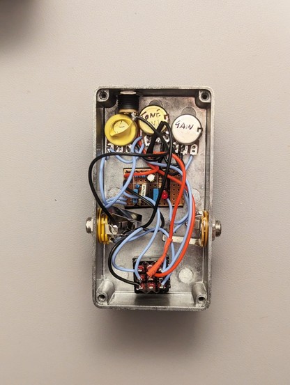 The inside circuitry of a diy bass pedal effect.