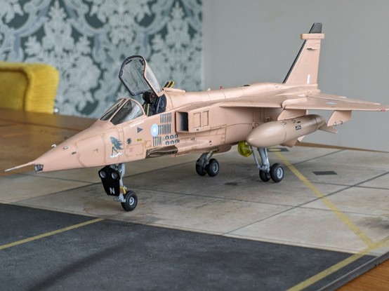 1/48 Scale completed plastic model kit of Sepecat Jaguar GR1 jet fighter, in desert pink livery from Operation Granby (first Gulf war)